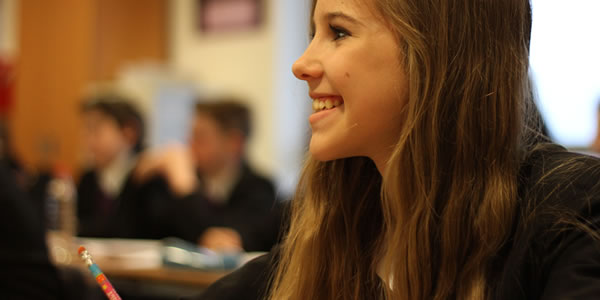 Smiling student in class
